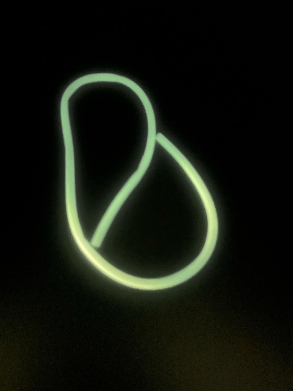 Glow-in-the-dark float tubing with bright green glowing loop