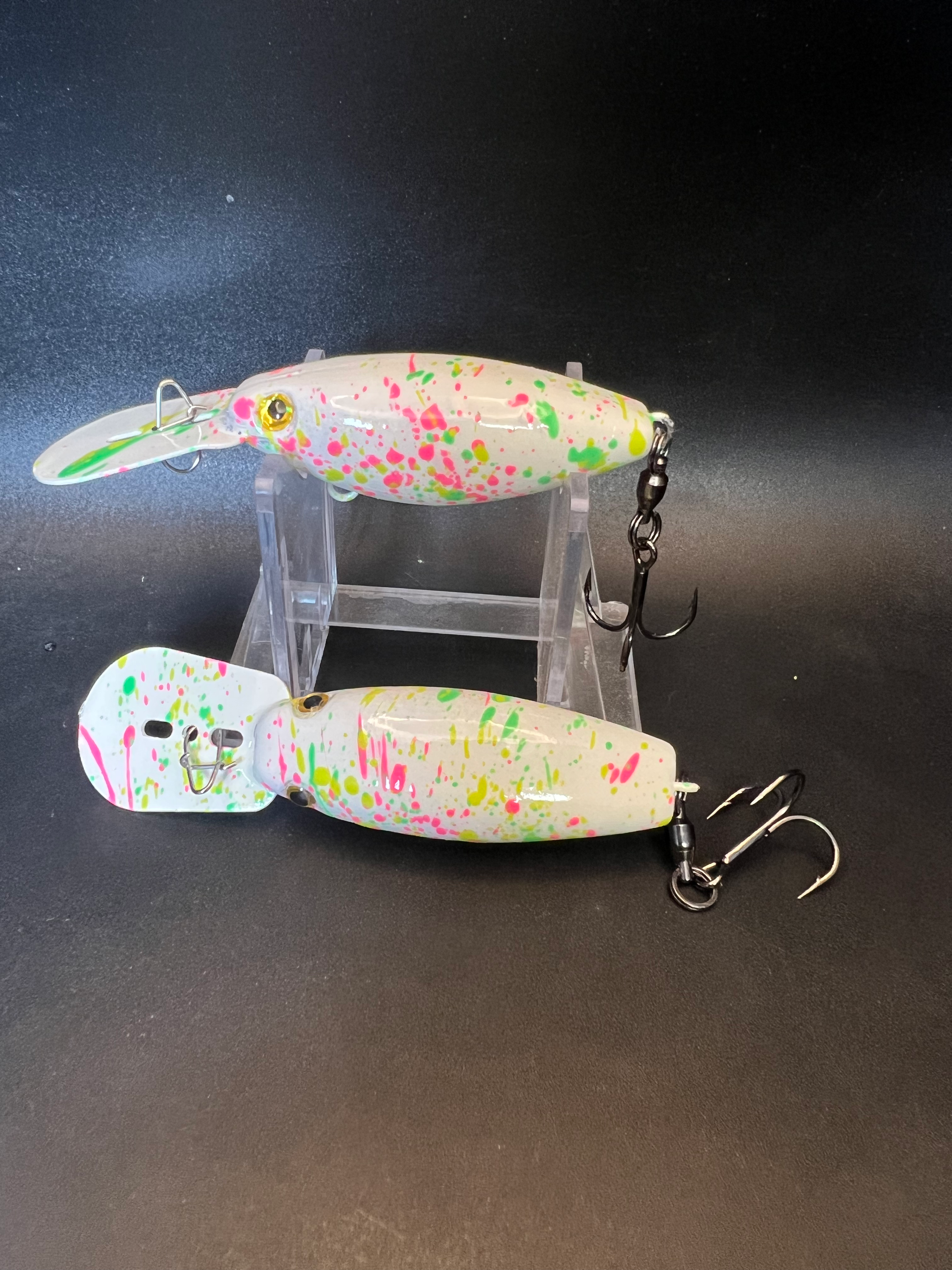 Trolling plug, white body with neon speckles; treble hooks and split rings