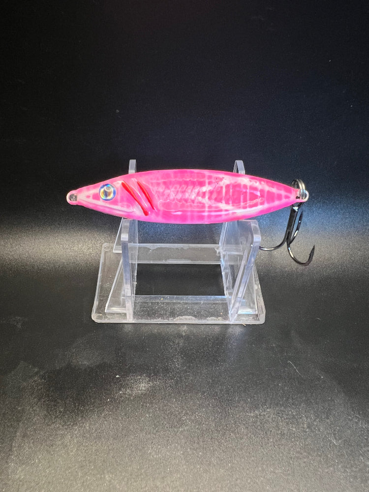 UV Glow 1.25 oz salmon jigging spoon, pink body with blue eye and treble hook