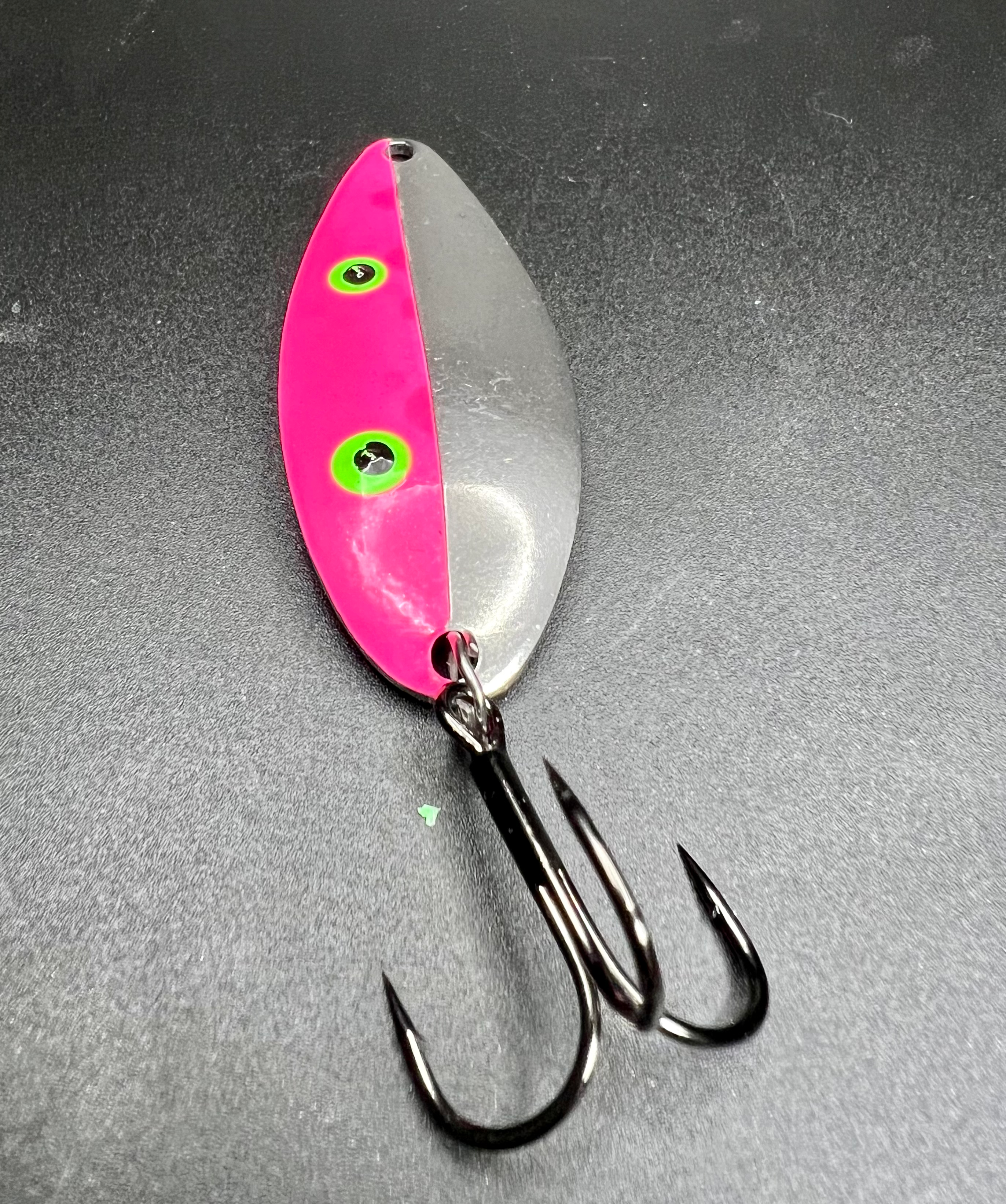 Neptunium Little Cletus Spoon lure, pink-silver with chartreuse eyes and treble hooks