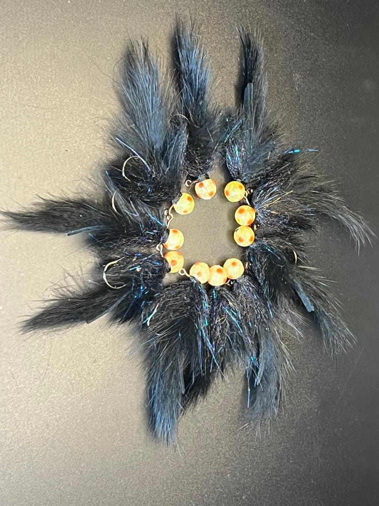 Hairy Tallywhacker egg sucking fly, blue-black fur with yellow bead ring