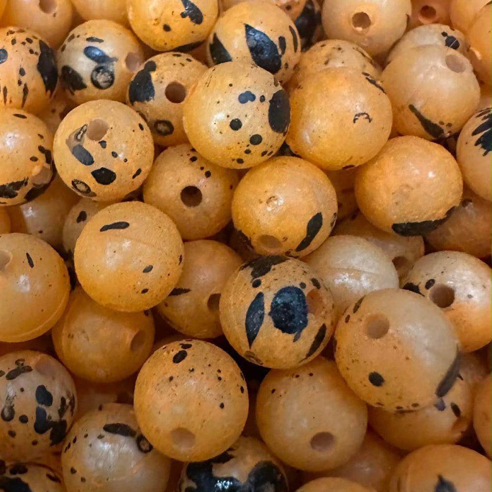 Jack-Roe-Lantern UV Glow plastic fishing beads, orange with black spots and holes