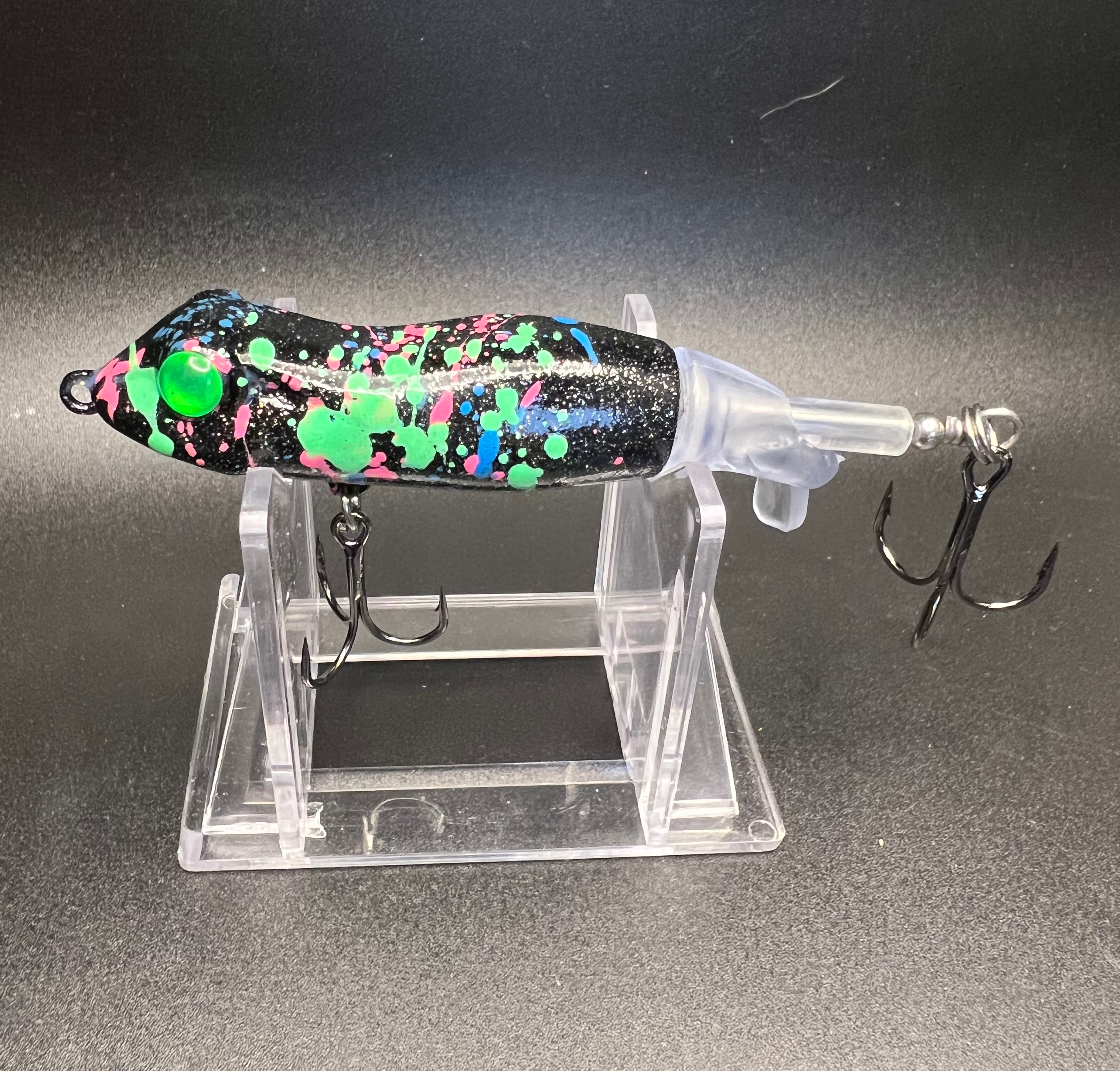 Cosmic Frog Flopper Plopper 90mm lure, black with neon green/pink/blue spots, 3 hooks