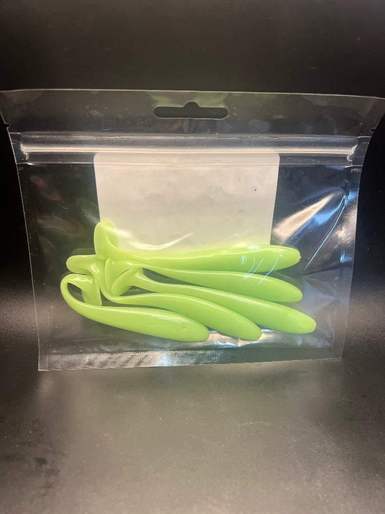 Neon green paddle tail swimbaits in retail bag