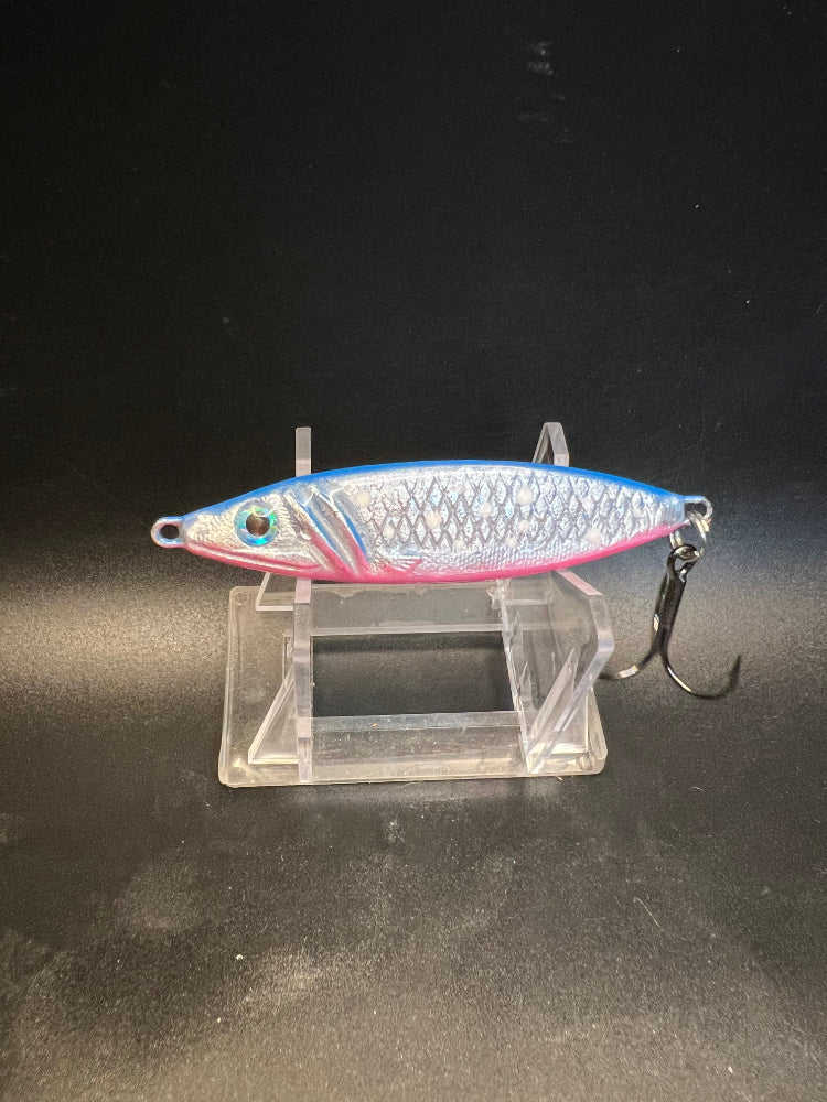 Salmon jigging spoon with silver scales, blue UV stripe, treble hook