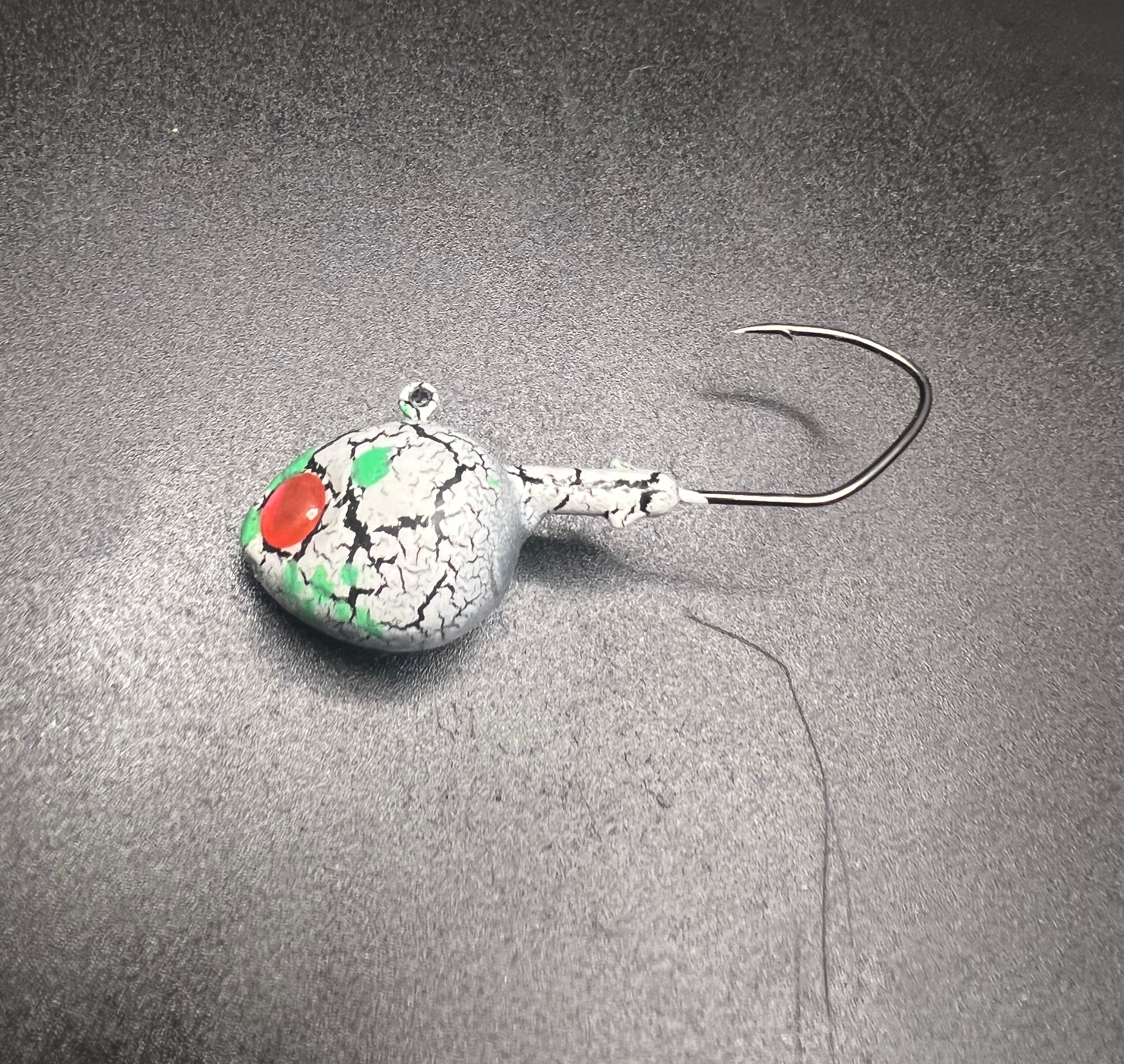 Acid Bath UV Walleye jig, speckled white with green/red spots and single hook
