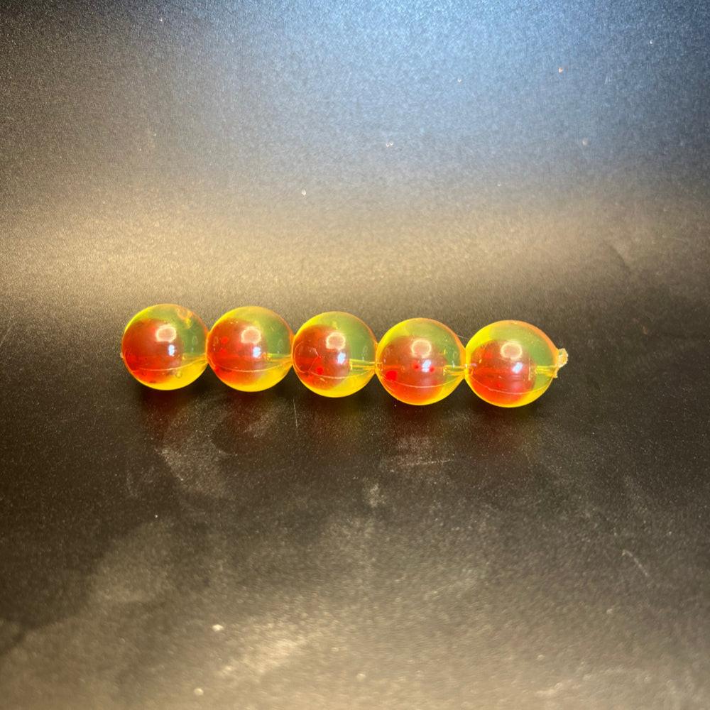 Blood Sun embryo soft plastic beads: translucent red-orange with green glow, 5 beads