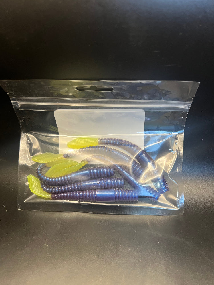 Soft plastic crawler bait set in dark blue/purple with ribbed segmented bodies in clear bag
