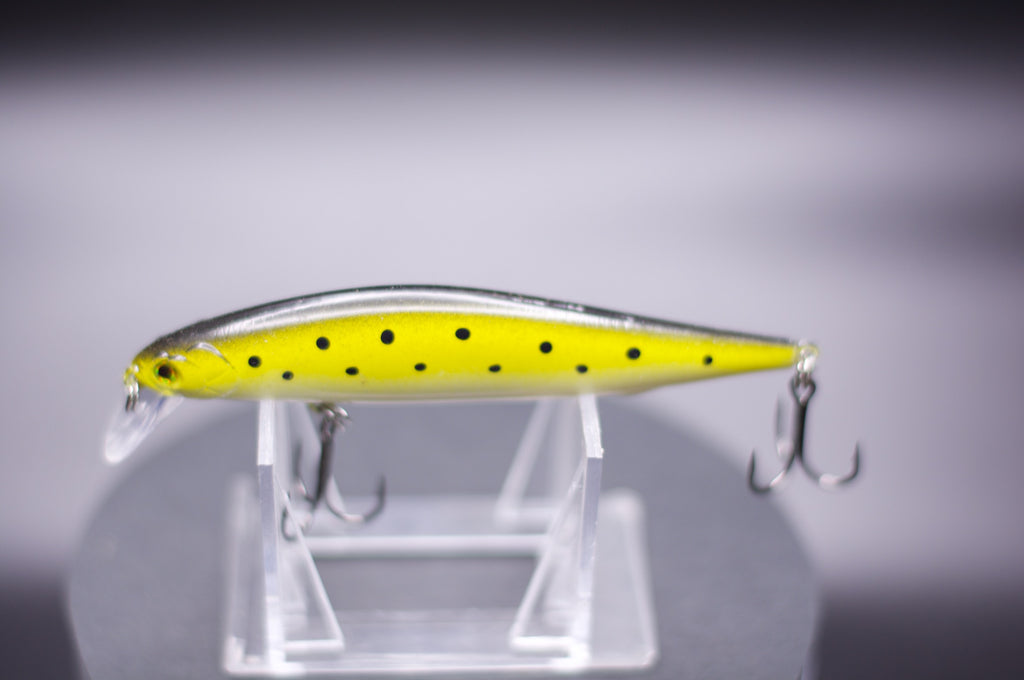 Yellow jerk bait with black dot pattern and two treble hooks, 1/2 oz