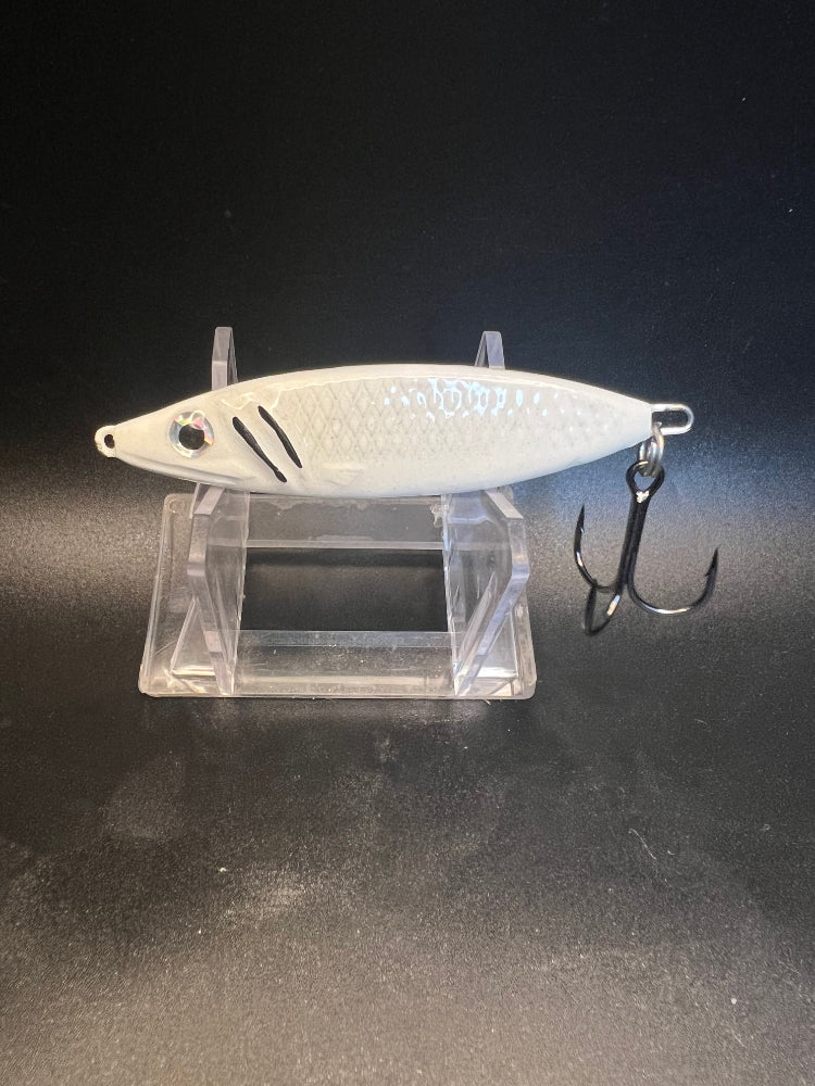 Whitefish striped UV glow jigging spoon, white with black accents, treble hooks
