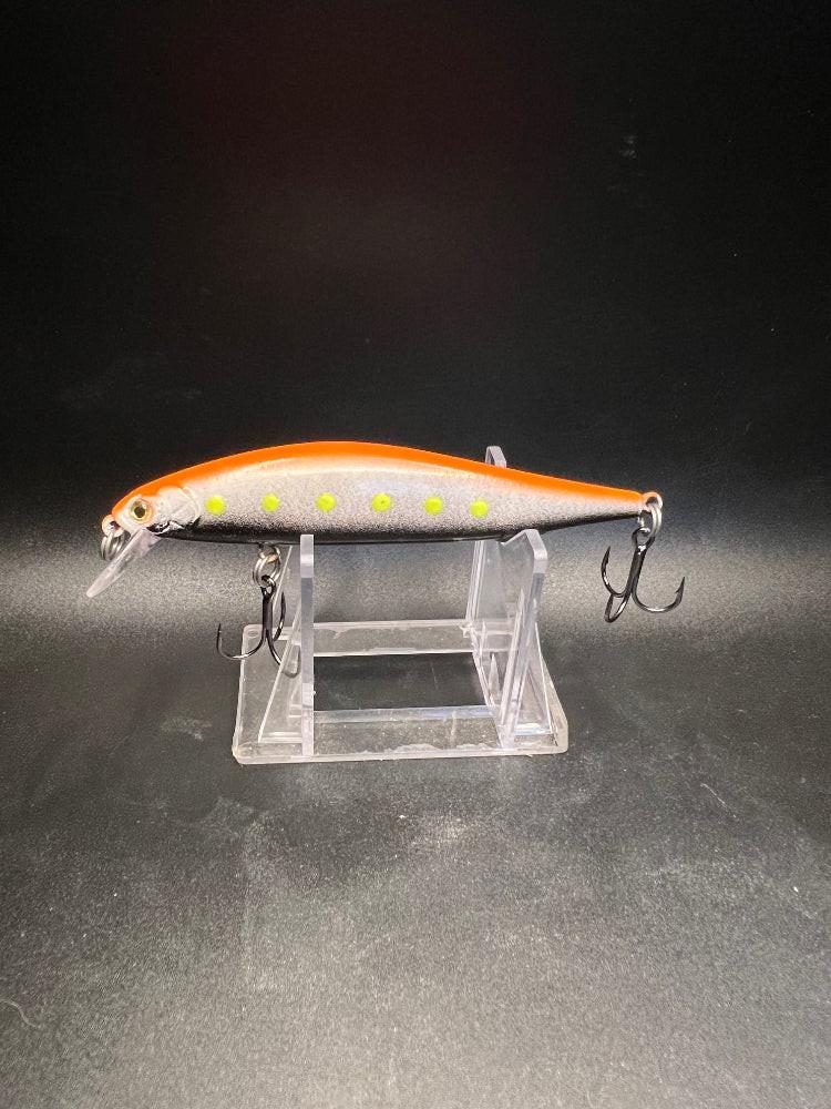 Pumpkin Spice 4.25in jerk bait, orange back with speckled dots and 3X hooks